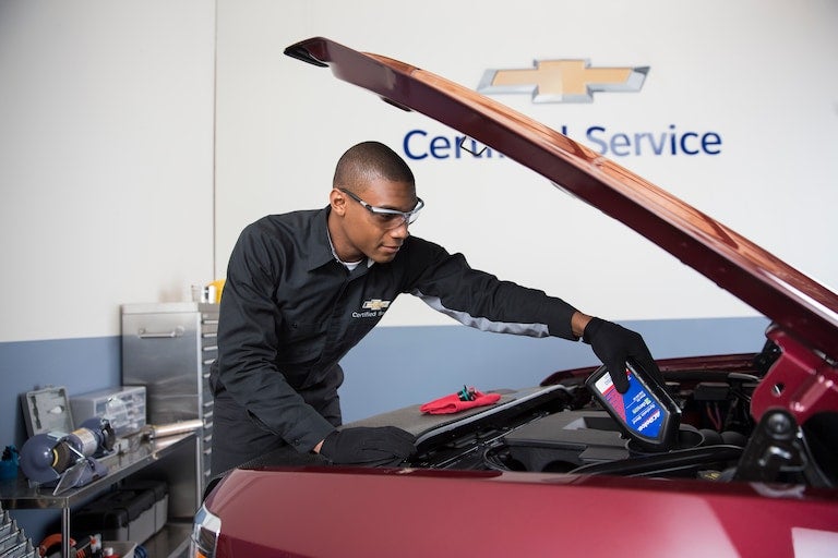 advisor inspecting vehicle Chevrolet of Troy in Troy OH