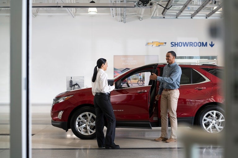 advisor inspecting vehicle Chevrolet of Troy in Troy OH