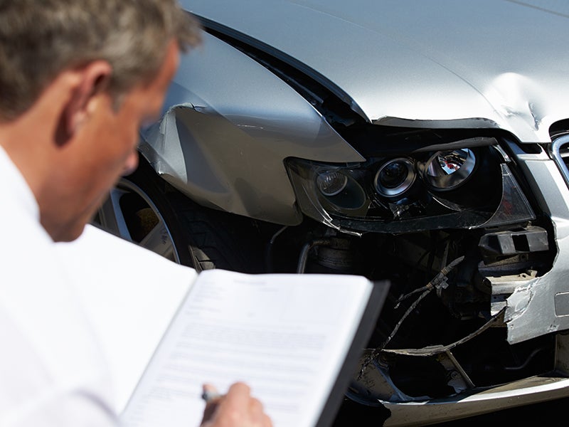 advisor inspecting vehicle Chevrolet of Troy in Troy OH